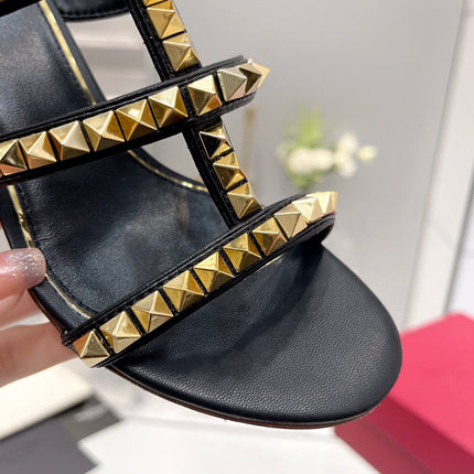 VALENTINO 26S ROCKSTUD STRAPPY BLOCK HEEL SLIDE SANDALS IN BLACK CALFSKIN GOLD HARDWARE