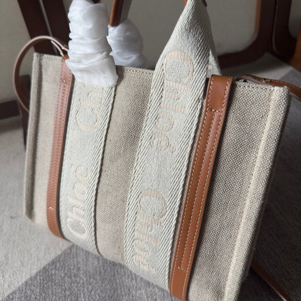 SMALL WOODY TOTE BAG 26.5 IN BEIGE LINEN CANVAS WEBBING LOGO EMBROIDERY BROWN CALFSKIN