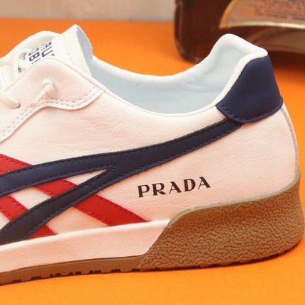 PRA SNEAKER IN WHITE CALFSKIN WITH NAVY BLUE AND RED STRIPED
