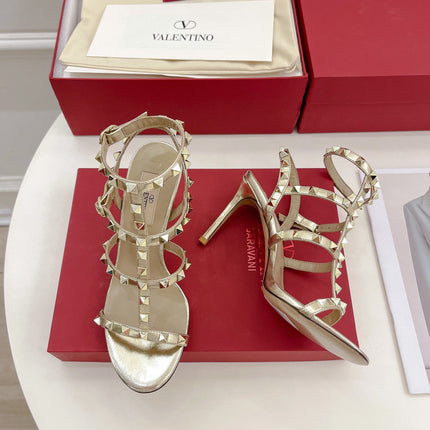 ROCKSTUD 100 GOLD METALLIC CALFSKIN ANKLE STRAP HIGH SANDAL