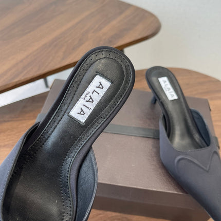 ALAIA 26S HEELED MULES 50 MM IN BLACK FABRIC