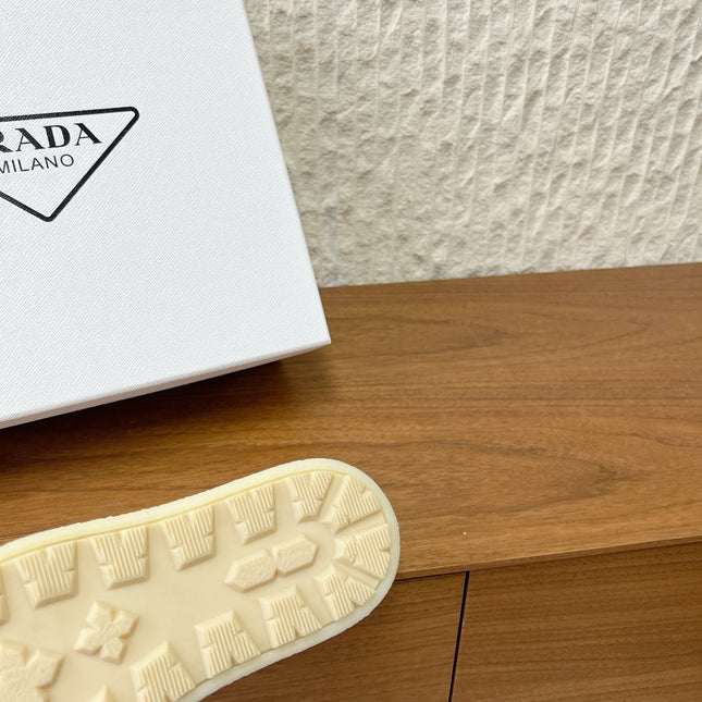 PRADA 25S PLATFORM FUR-LINED MULES IN EARTH BROWN SUEDE