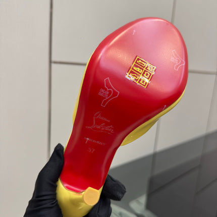 CHRISTIAN LOUBOUTIN 26S OPEN-TOE HIGH HEEL SANDALS 105 MM IN YELLOW GLOSSY CALFSKIN