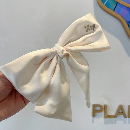DIOR 26S BOW HAIR CLIP IN WHITE SILK 500721
