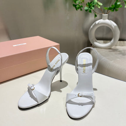 TWO STRAP HIGH HEELED SANDALS IN WHITE GLOSSY SHEEPSKIN