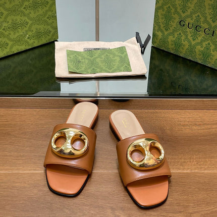 FLAT MULE IN BRONE BROWN CALFSKIN WITH GOLD HARDWARE