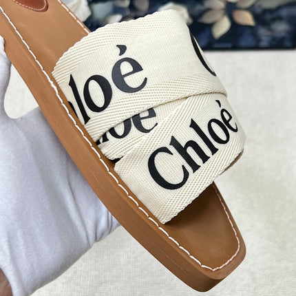 CHLOE 26S CRISSCROSS SLIDES IN BEIGE CANVAS