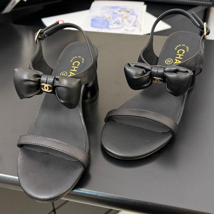MID HEEL SANDALS IN BLACK CALFSKIN WITH BOW