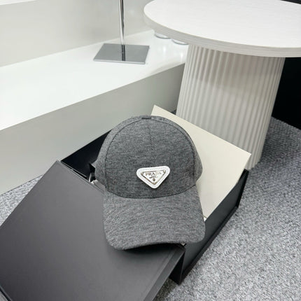 PRADA 26S BASEBALL CAP IN GREY 558604