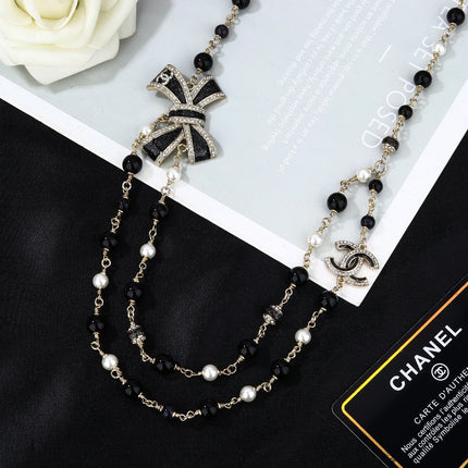 CHANEL 25S CHAIN BELT IN BLACK AND WHITE PEARL 614285