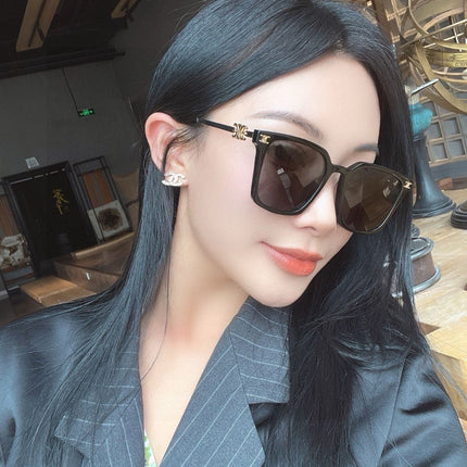 TRIOMPHE SUNGLASS 497820 IN GOLD METAL BLACK LENSES