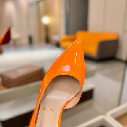 CHRISTIAN LOUBOUTIN 26S CUTOUT SIDE PUMP HEELS 105 MM IN ORANGE PATENT CALFSKIN
