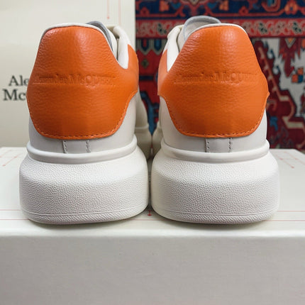 OVERSIZED SNEAKER IN WHITE CALFSKIN ORANGE HEEL TAB EMBOSSED LOGO