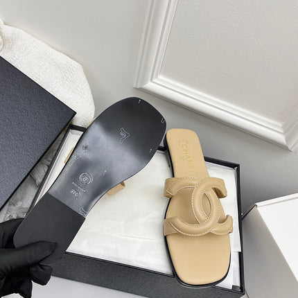 CHANEL CC LOGO MULES IN BEIGE CALFSKIN