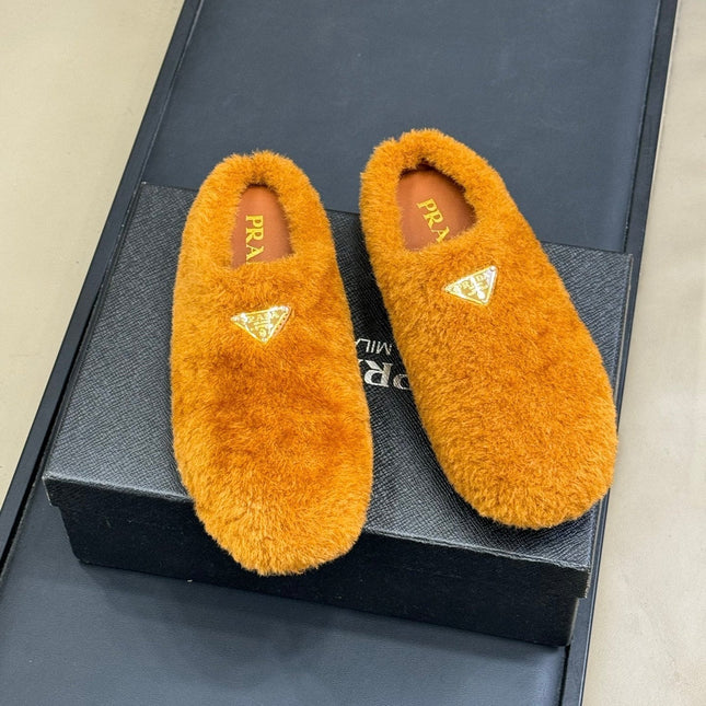 PRADA 25S CLOGS IN DARK ORANGE SHEARLING