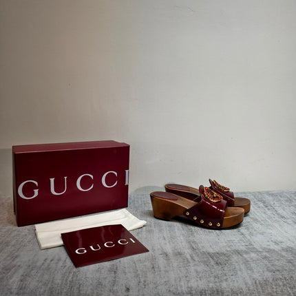 GUCCI 26S PLATFORM MULES IN BURGUNDY RED PATENT CALFSKIN GOLD HARDWARE