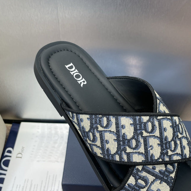 DIOR 25S ALIAS CROSS-STRAP SLIDES IN BLACK CALFSKIN WITH CD OBLIQUE DEEP BLUE LOGO